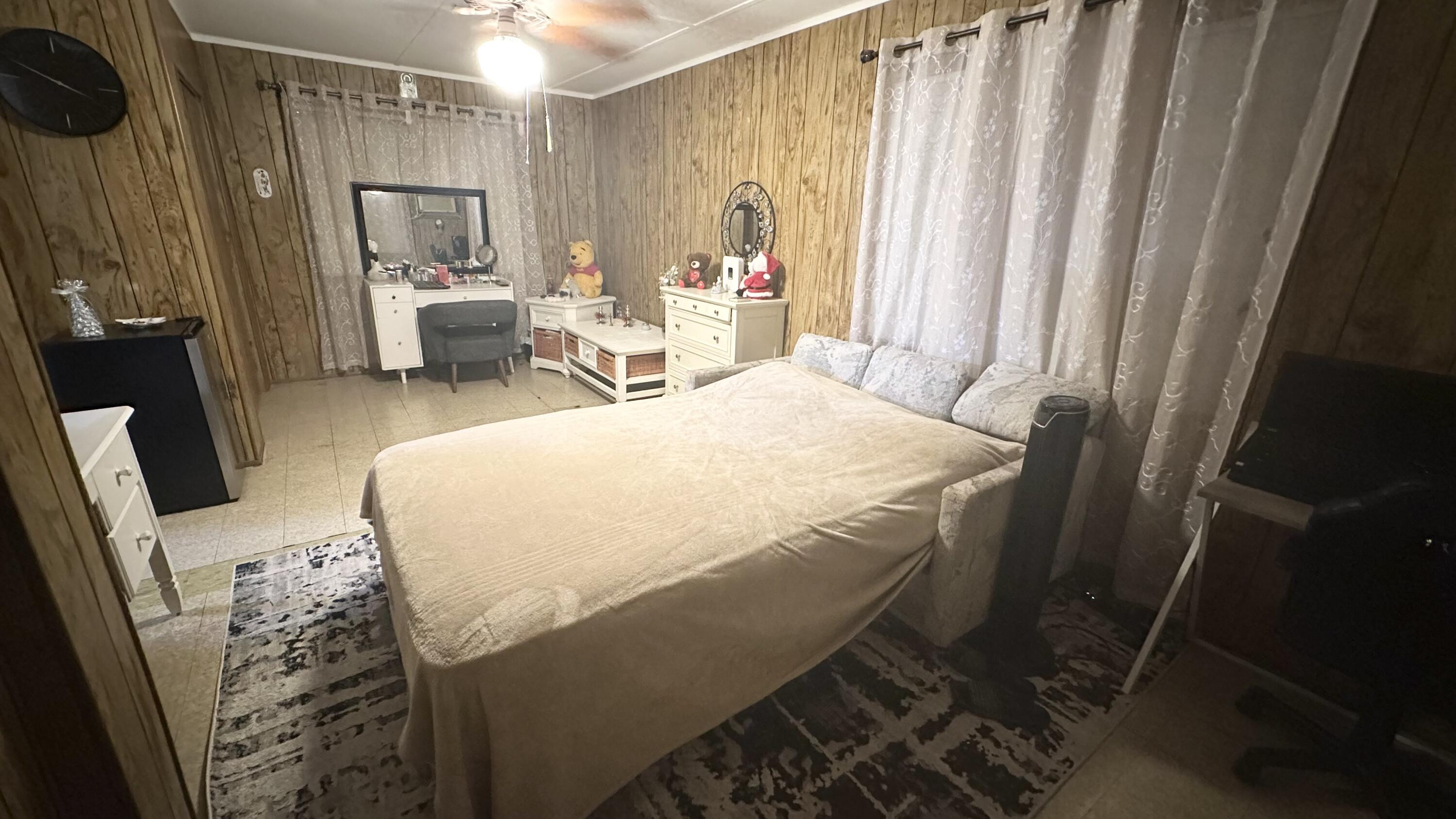 1105 Watson Street Key West, FL 33040 - Photo 15 of 26 a bedroom with a bed and a mirror