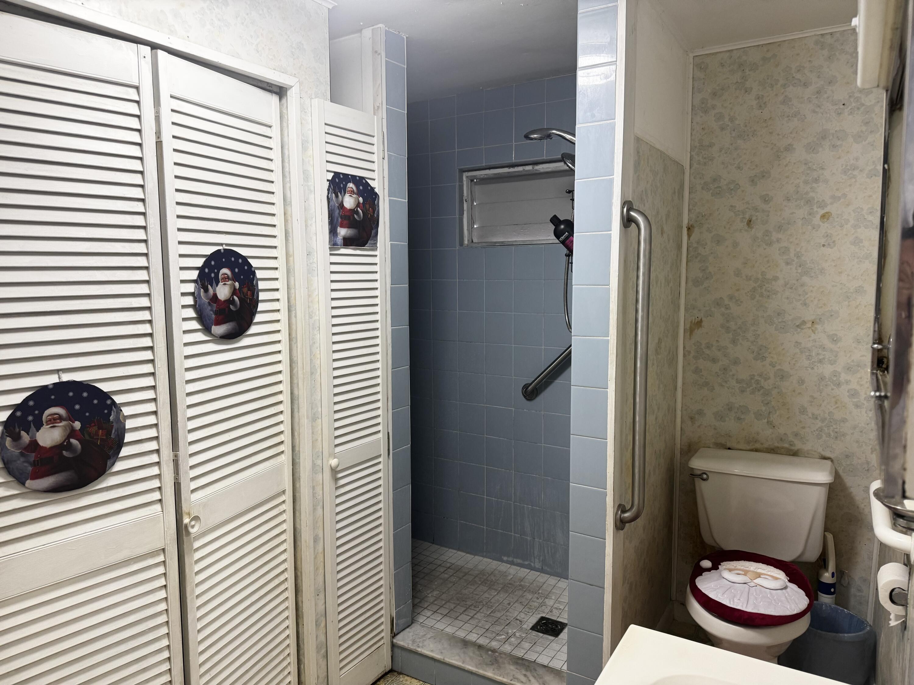 1105 Watson Street Key West, FL 33040 - Photo 20 of 26 a bathroom with a toilet and a shower
