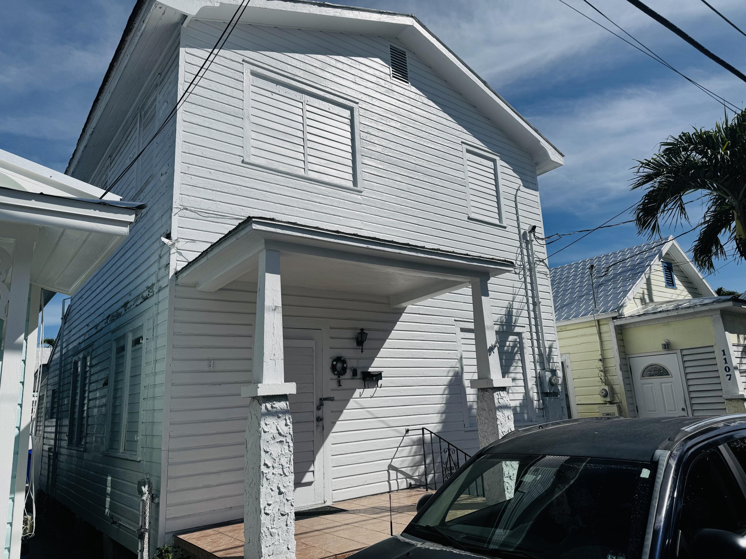 1105 Watson Street Key West, FL 33040 - Photo 2 of 26 a view of a house with a roof deck