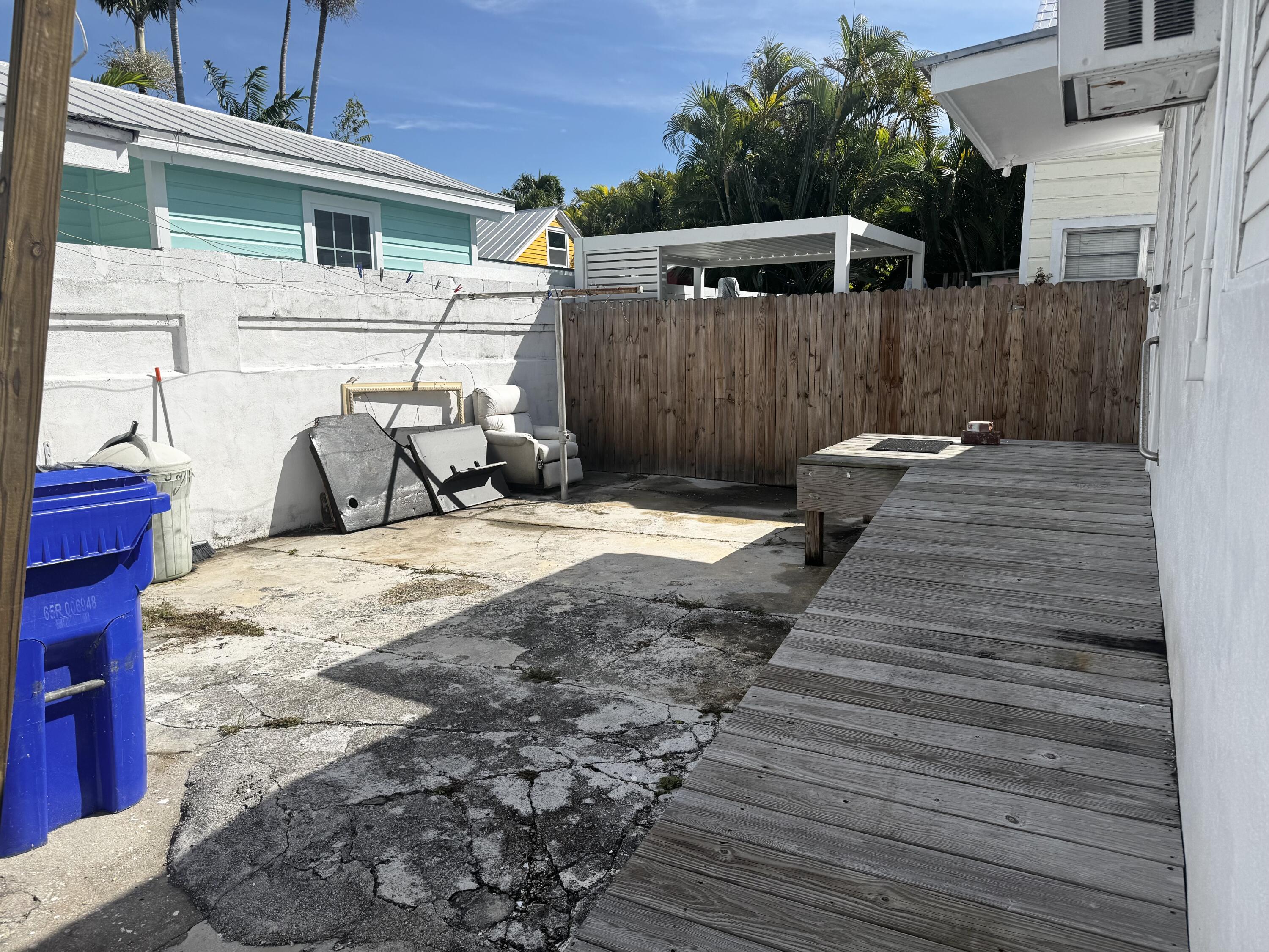 1105 Watson Street Key West, FL 33040 - Photo 25 of 26 front view of a house with two chairs