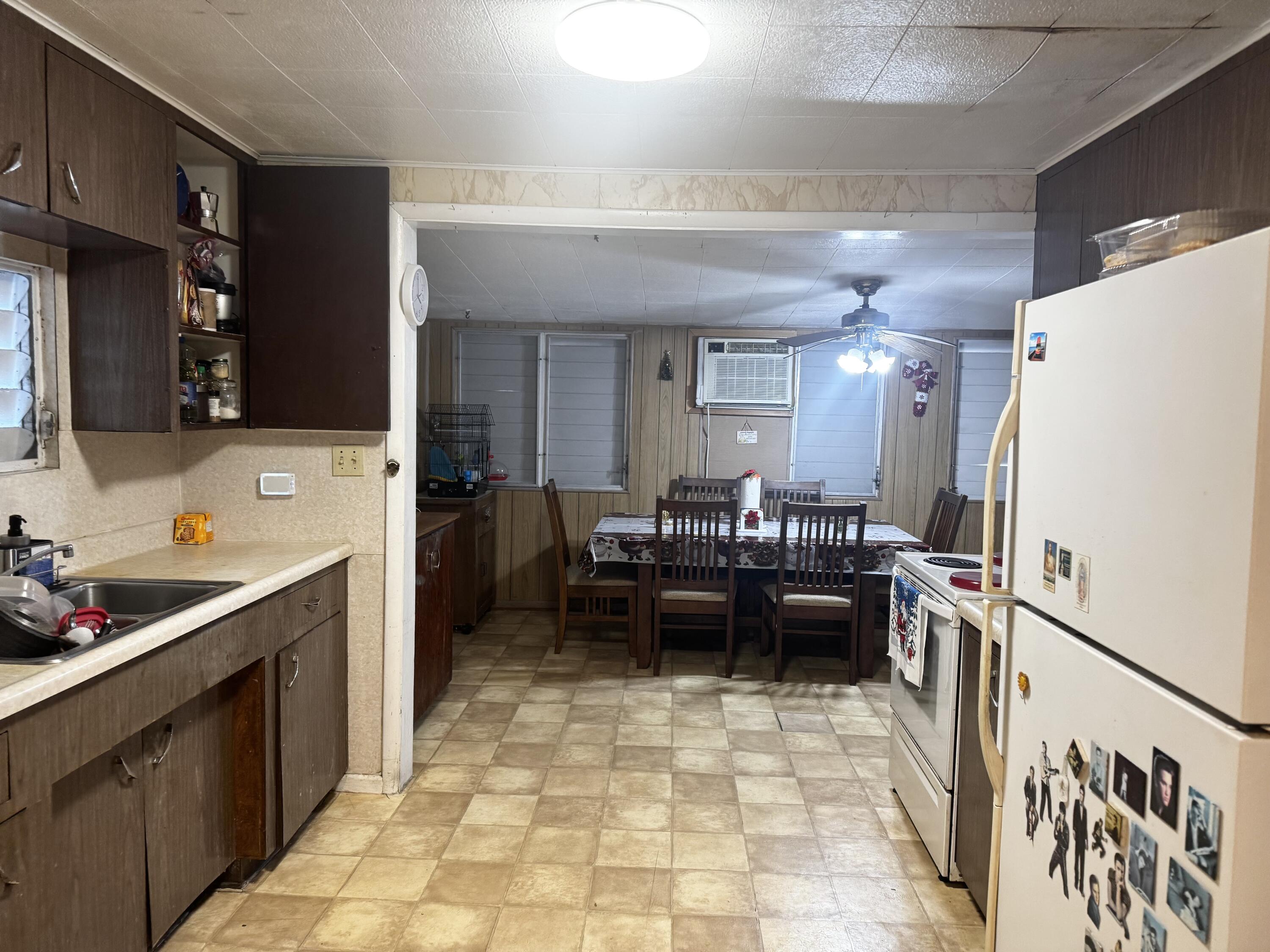 1105 Watson Street Key West, FL 33040 - Photo 7 of 26 a kitchen with a refrigerator and a counter top space