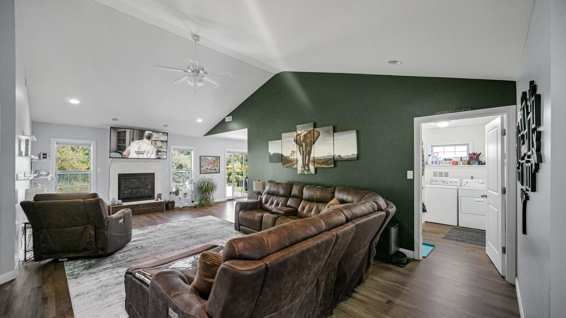371 South Boo Road Chesterton, IN 46304 - Photo 4 of 24 a living room with furniture a fireplace and a flat screen tv