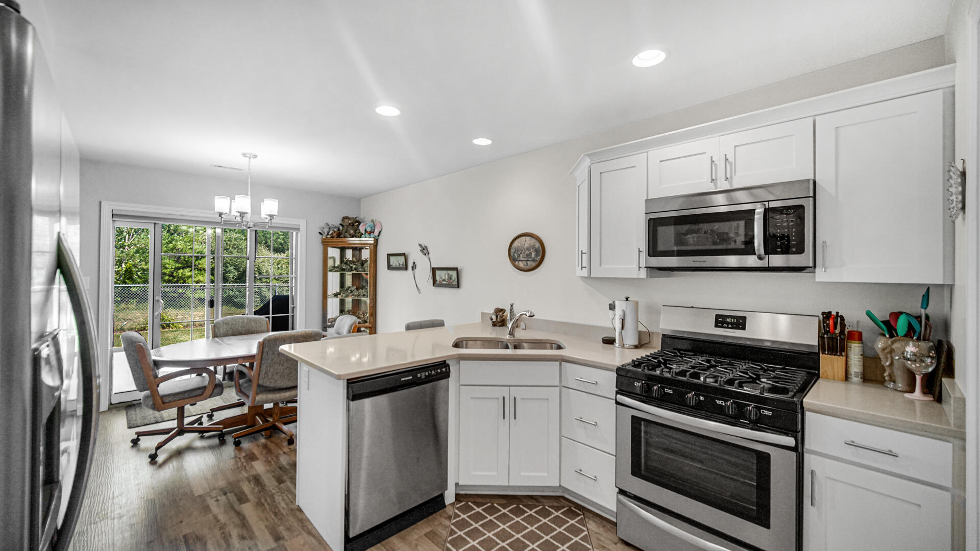 371 South Boo Road Chesterton, IN 46304 - Photo 8 of 24 a kitchen with a stove a sink and a microwave