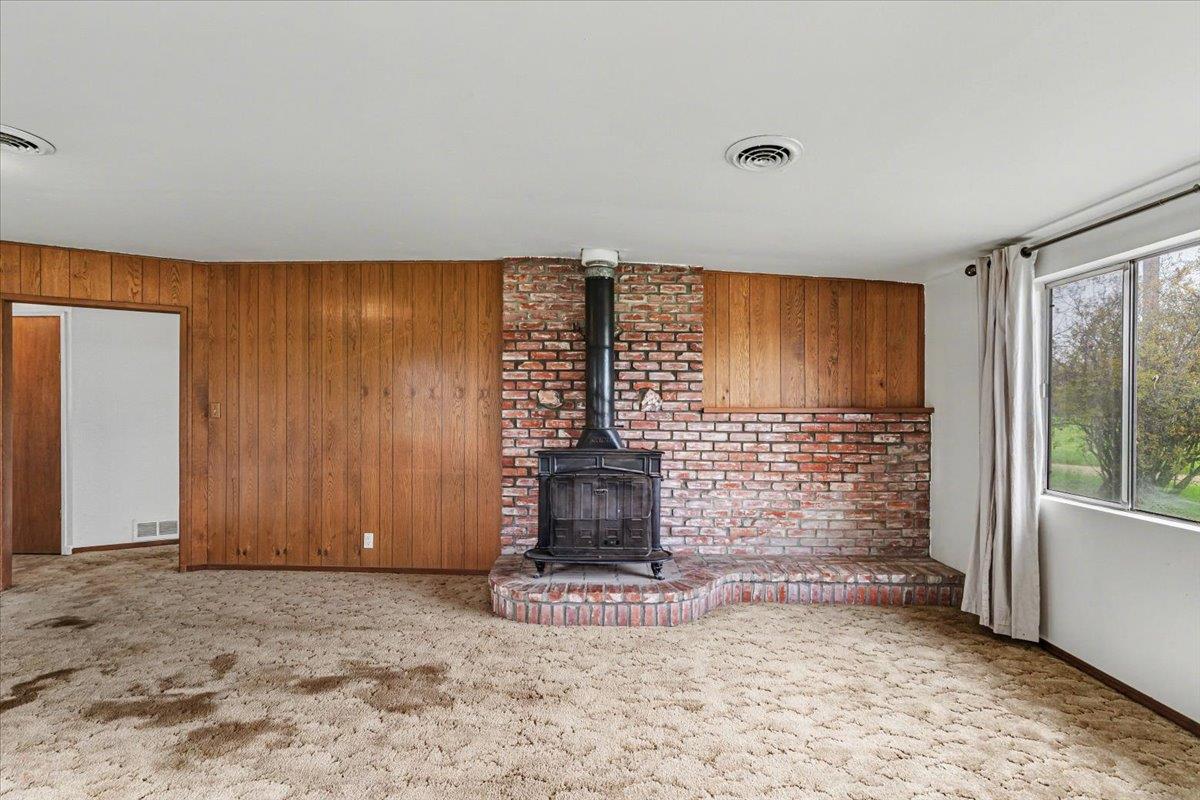 2679 Lobo Avenue Merced, CA 95348 - Photo 13 of 88 a view of a livingroom with wooden floor and a fireplace