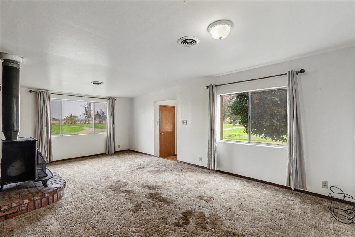2679 Lobo Avenue Merced, CA 95348 - Photo 15 of 88 a view of an empty room with a window and kitchen view