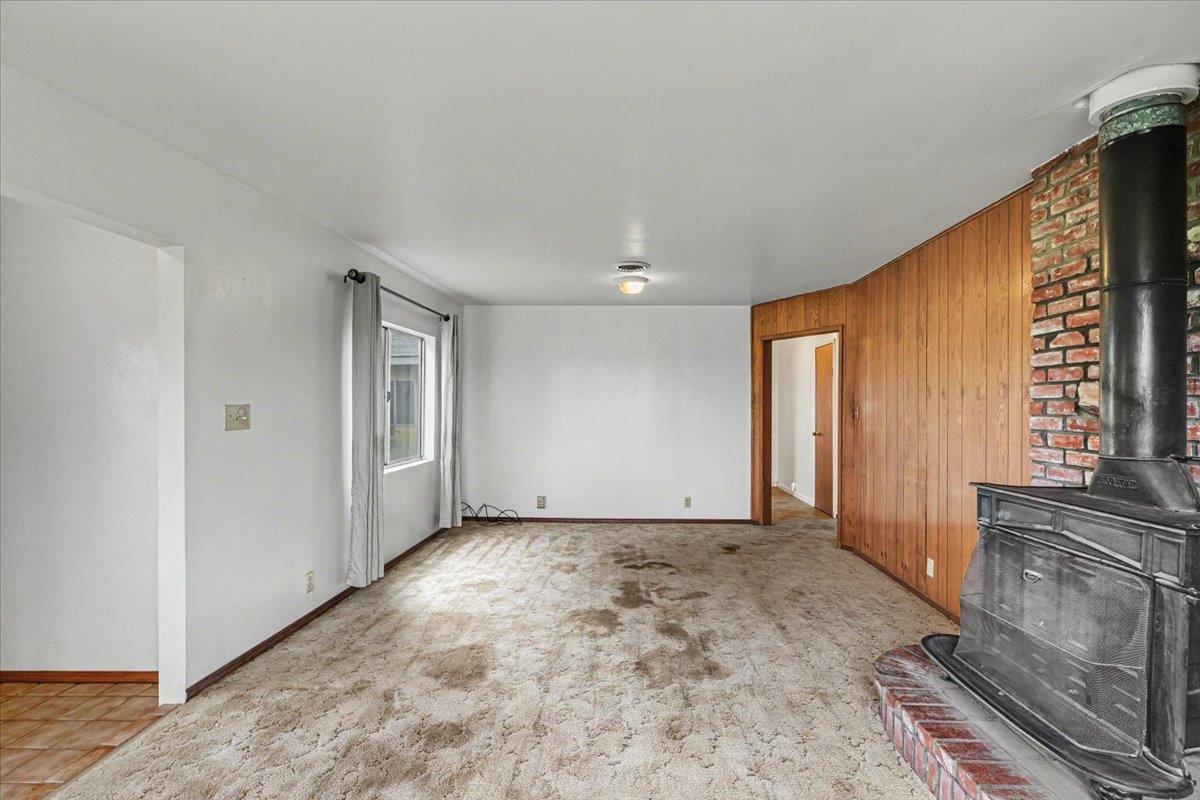 2679 Lobo Avenue Merced, CA 95348 - Photo 19 of 88 a view of an empty room with a fireplace