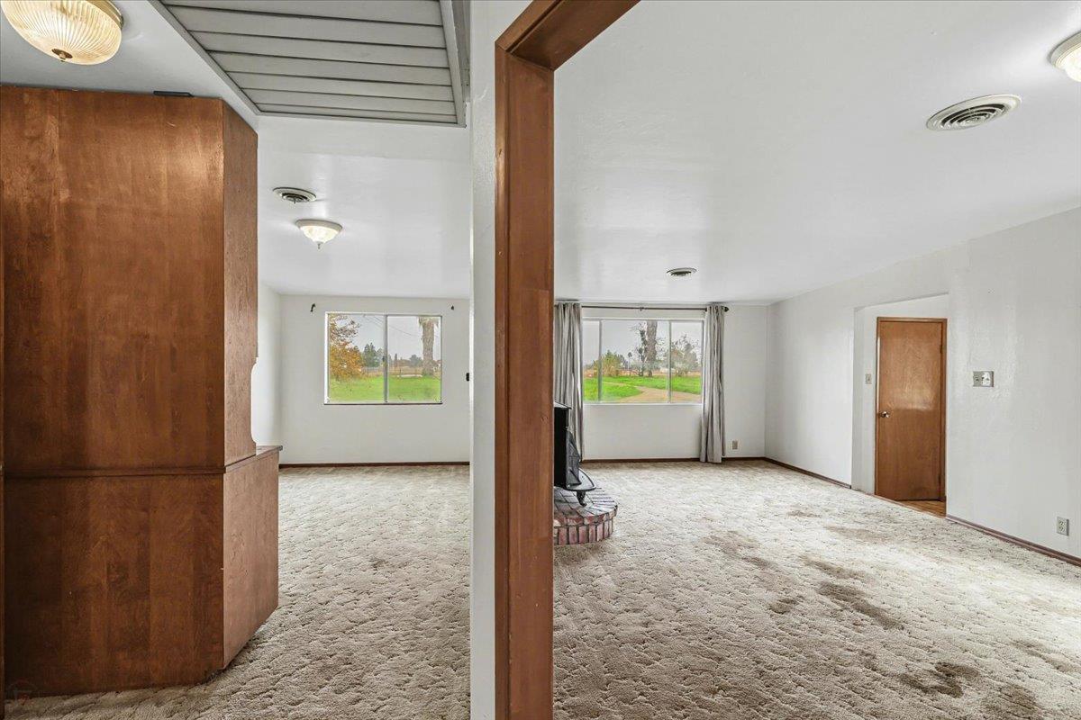 2679 Lobo Avenue Merced, CA 95348 - Photo 21 of 88 Dining Room + Family Room from Hallway