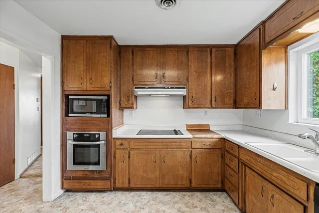 a view of a livingroom with a ceiling fan and a window