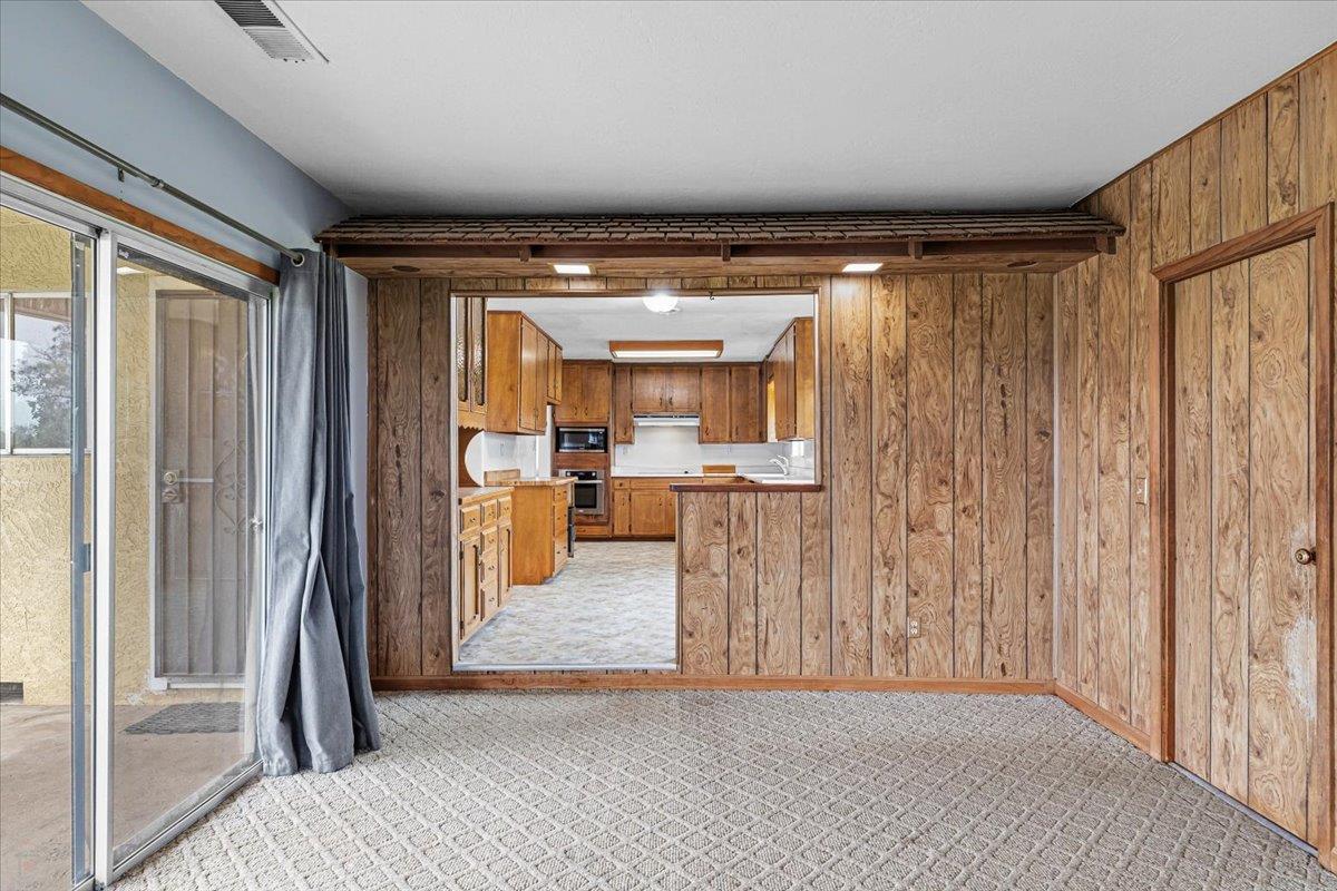 2679 Lobo Avenue Merced, CA 95348 - Photo 40 of 88 a view of a hallway with a furniture and a kitchen