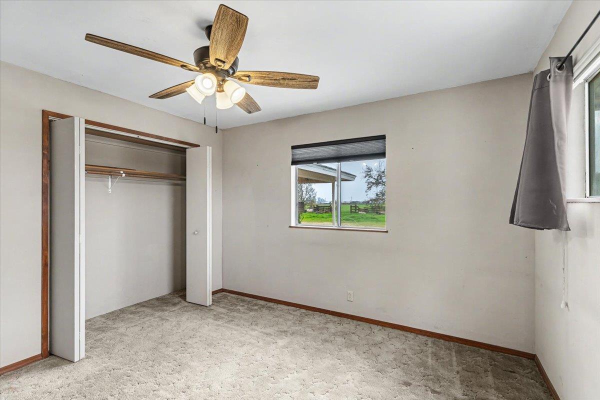 2679 Lobo Avenue Merced, CA 95348 - Photo 45 of 88 an empty room with windows and fan