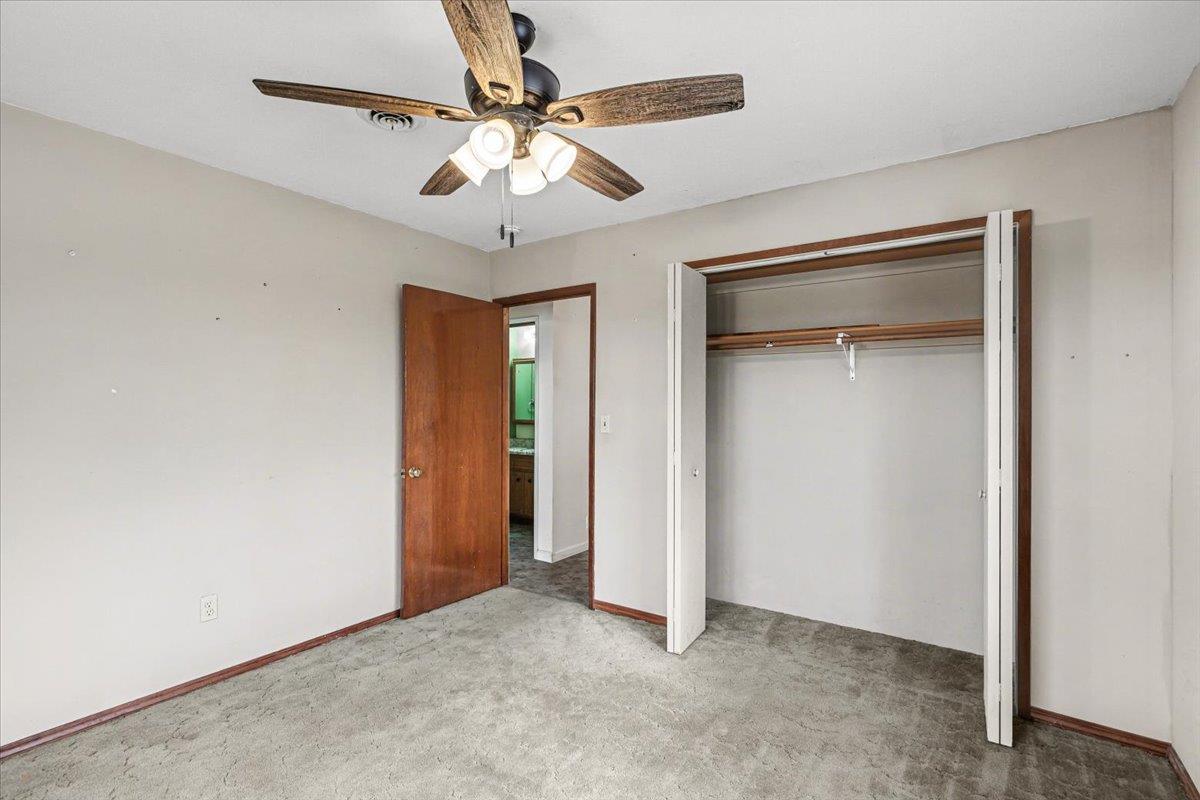 2679 Lobo Avenue Merced, CA 95348 - Photo 46 of 88 an empty room with closet and a ceiling fan