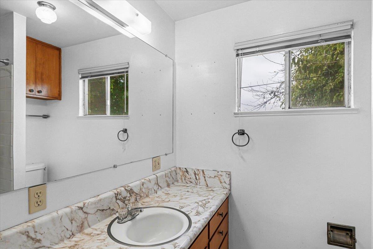 2679 Lobo Avenue Merced, CA 95348 - Photo 52 of 88 a bathroom with a granite countertop sink a toilet and mirror