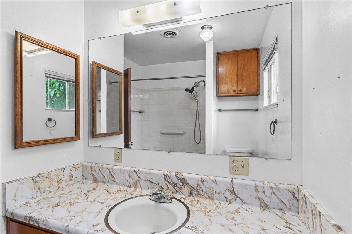 2679 Lobo Avenue Merced, CA 95348 - Photo 53 of 88 a bathroom with a granite countertop sink and a mirror