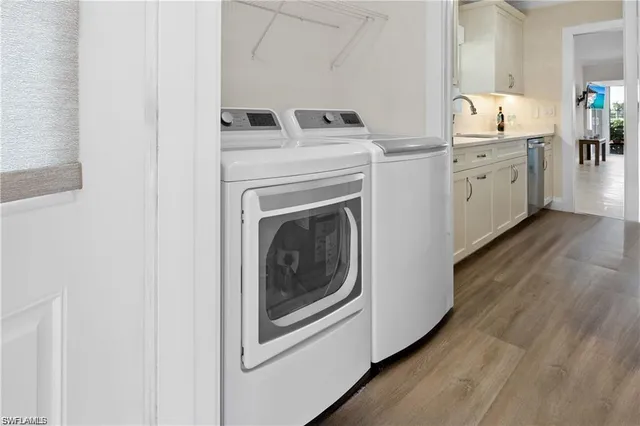a bathroom with a double vanity sink toilet mirror and shower