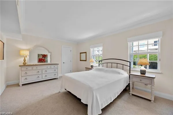 a bed room with furniture and a window