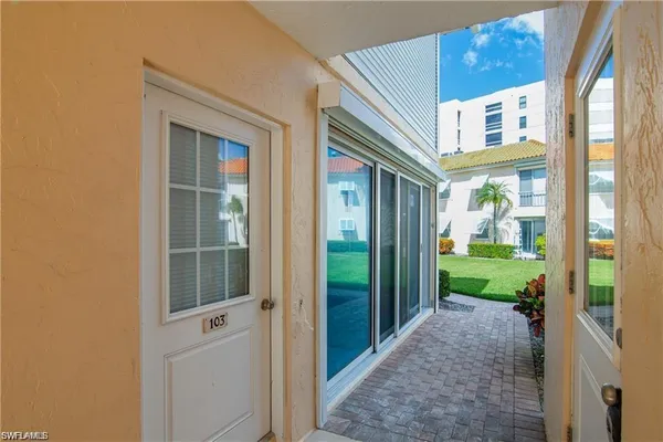 a view of a swimming pool with a patio
