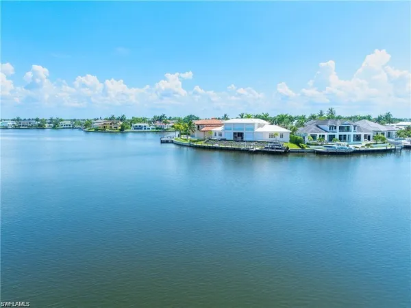 a wooden bench sitting in front of a building
