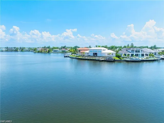 a wooden bench sitting in front of a building