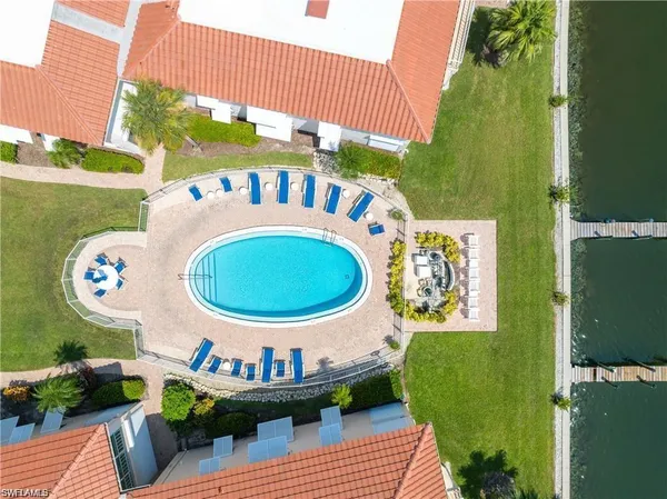 a park view of water with mountains in the background