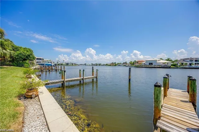 a view of a swimming pool with an ocean view