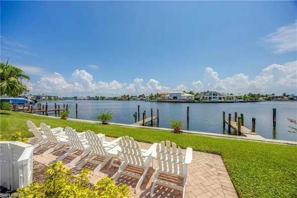 a view of a swimming pool and lounge chairs