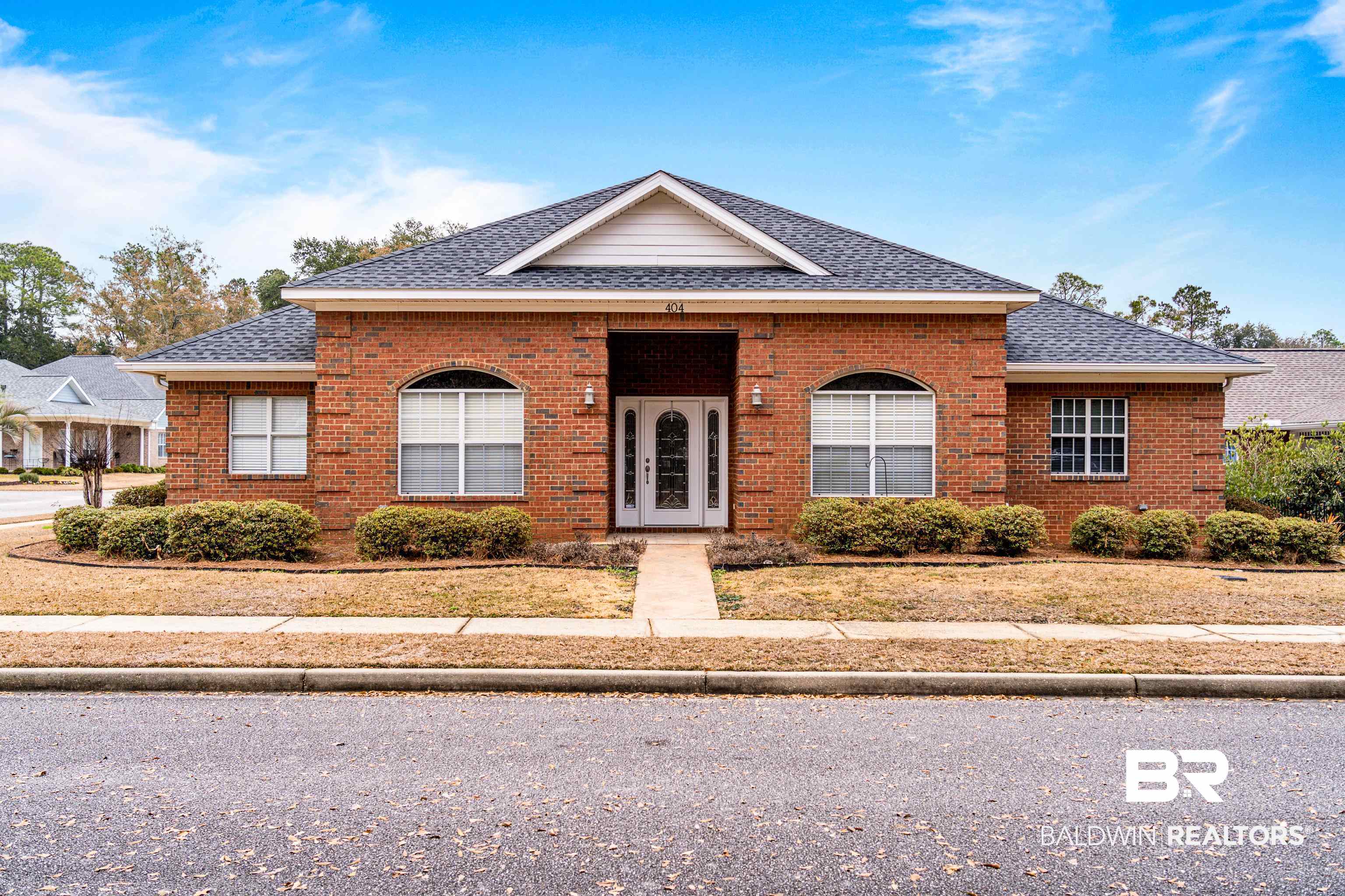 404 Savannah Lane Foley, AL 36535 - Photo 4 of 29 View of front of property featuring brick siding and roof with shingles