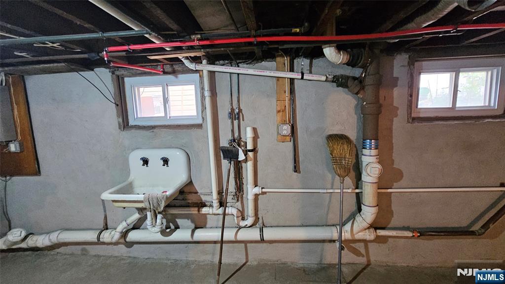 164 Humboldt Street East Rutherford, NJ 07073 - Photo 9 of 12 a storage room with wooden floor and windows