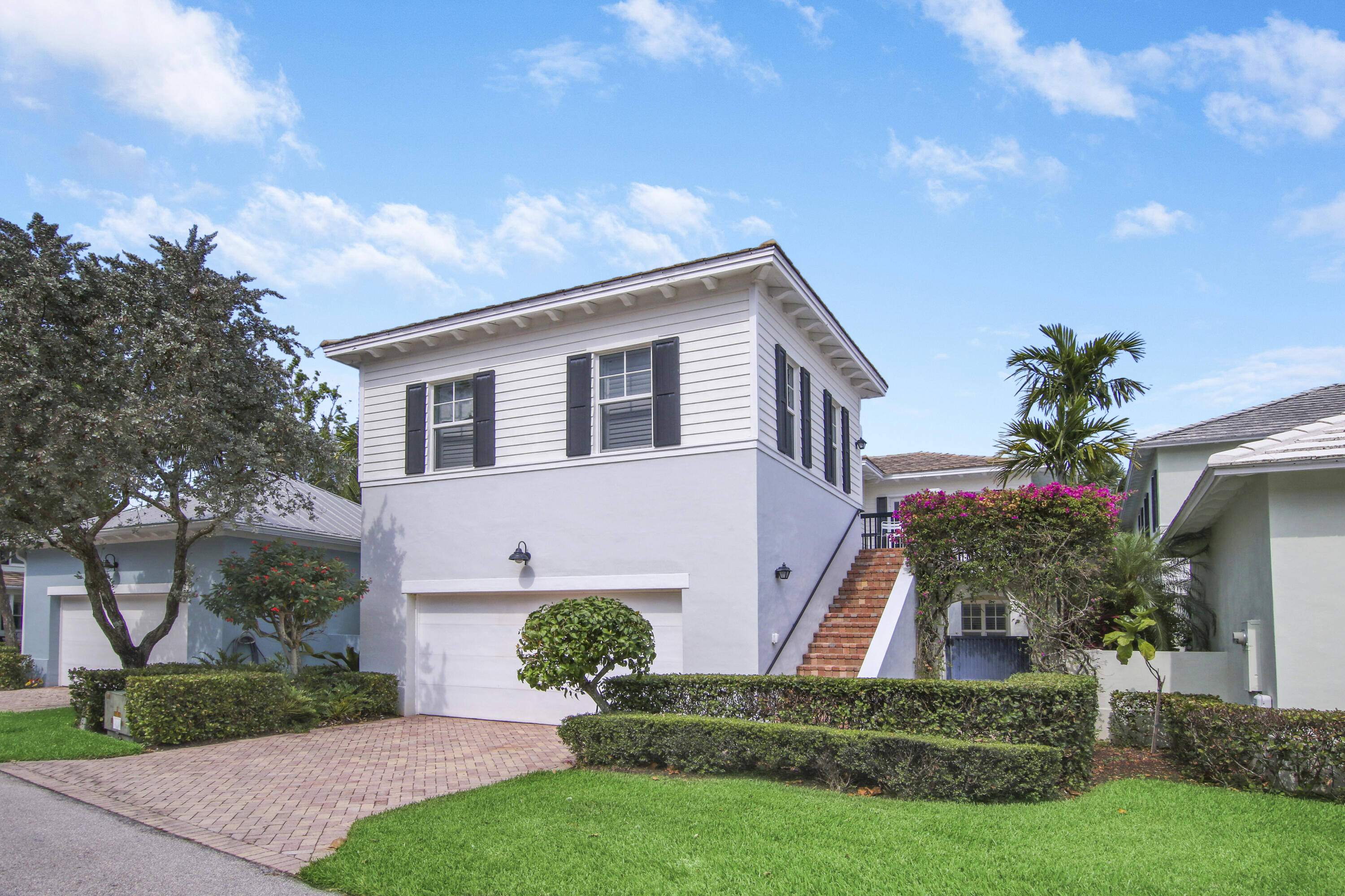 108 Spikerush Road Jupiter, FL 33458 - Photo 9 of 9 a front view of house with a garden