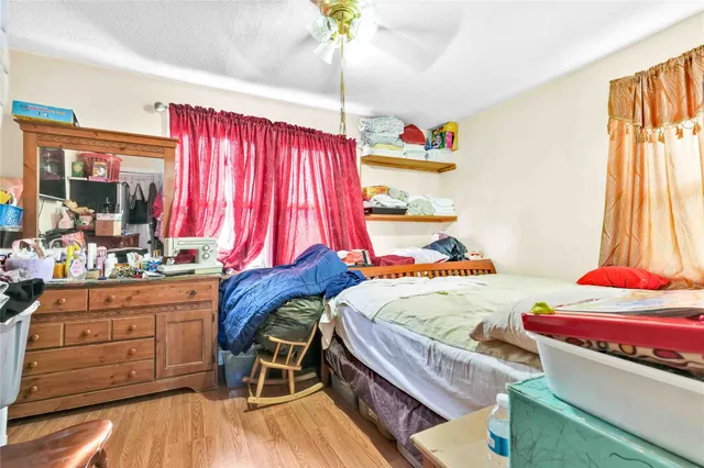 a bedroom with a bed and a dresser