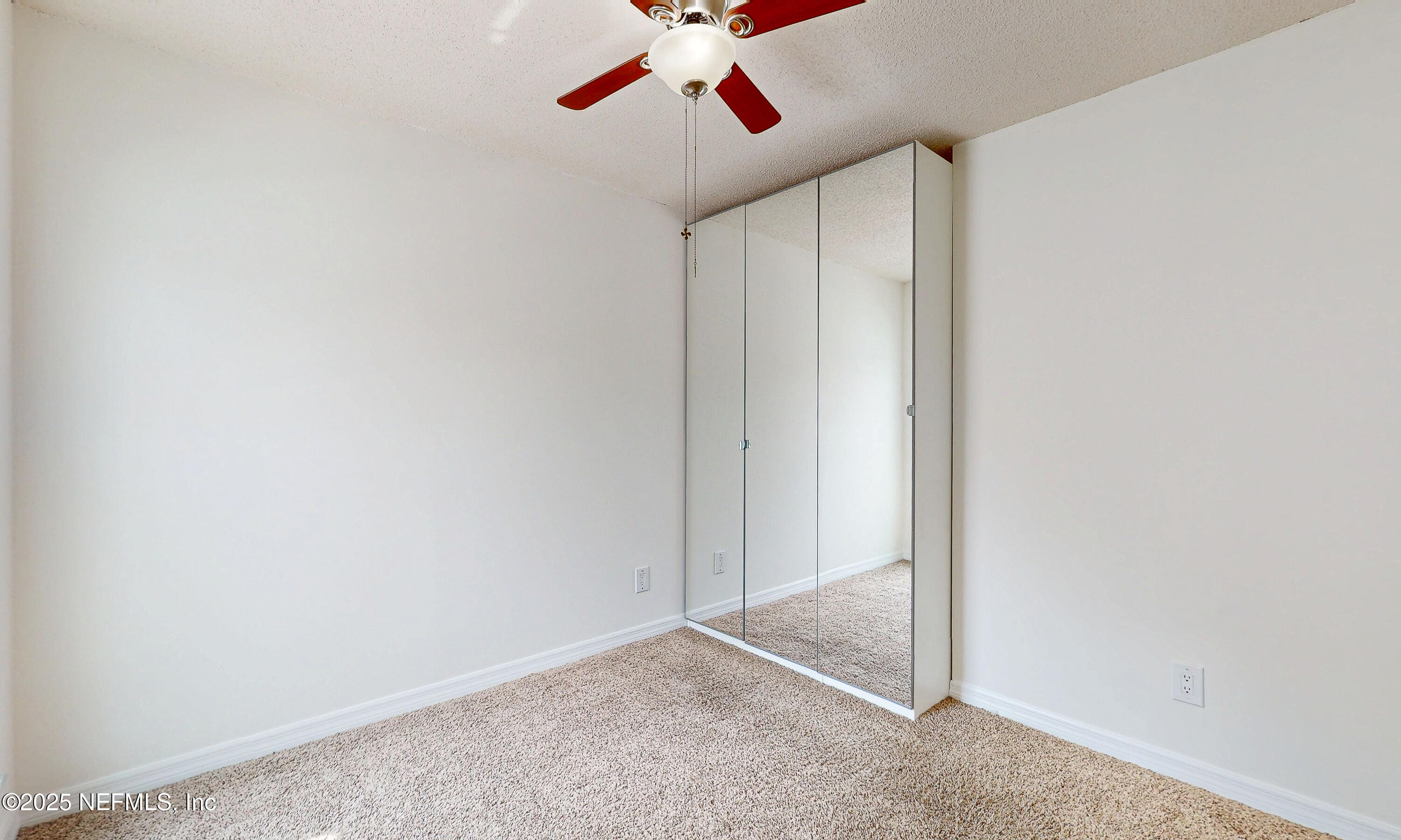 6433 River Point Drive Fleming Island, FL 32003 - Photo 37 of 76 an empty room with fan and entryway