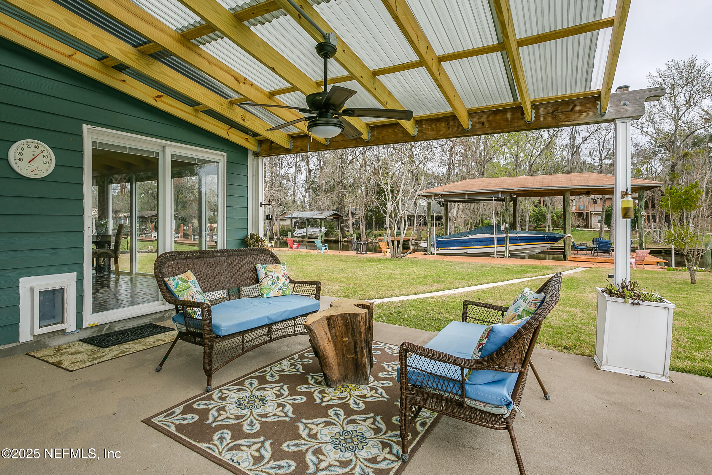 6433 River Point Drive Fleming Island, FL 32003 - Photo 41 of 76 a view of a swimming pool with a table and chairs