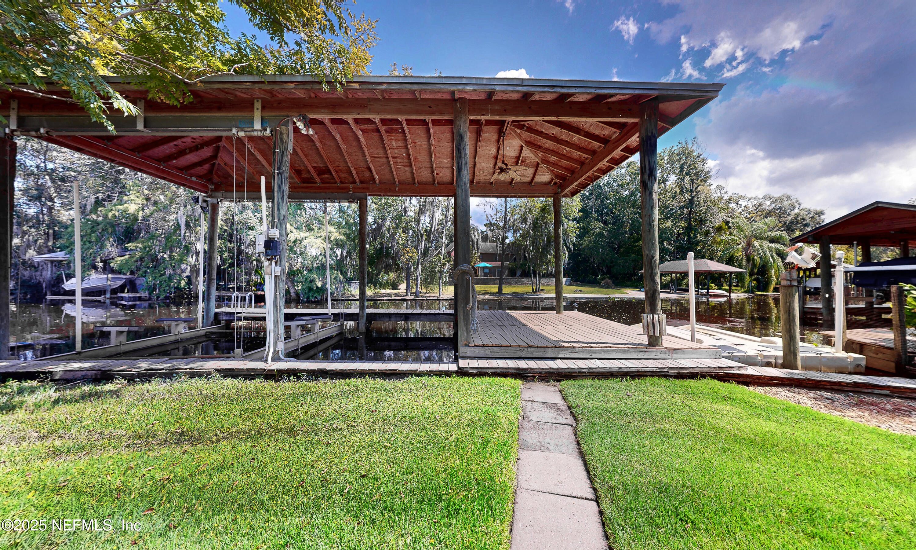 6433 River Point Drive Fleming Island, FL 32003 - Photo 53 of 76 a view of a swimming pool with sitting area