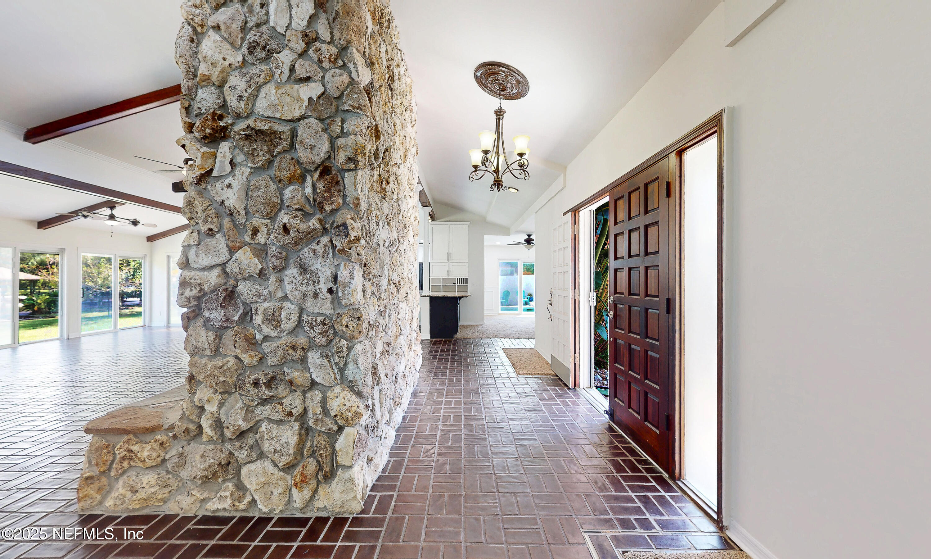 6433 River Point Drive Fleming Island, FL 32003 - Photo 6 of 76 a view of a hallway view with wooden floor and staircase