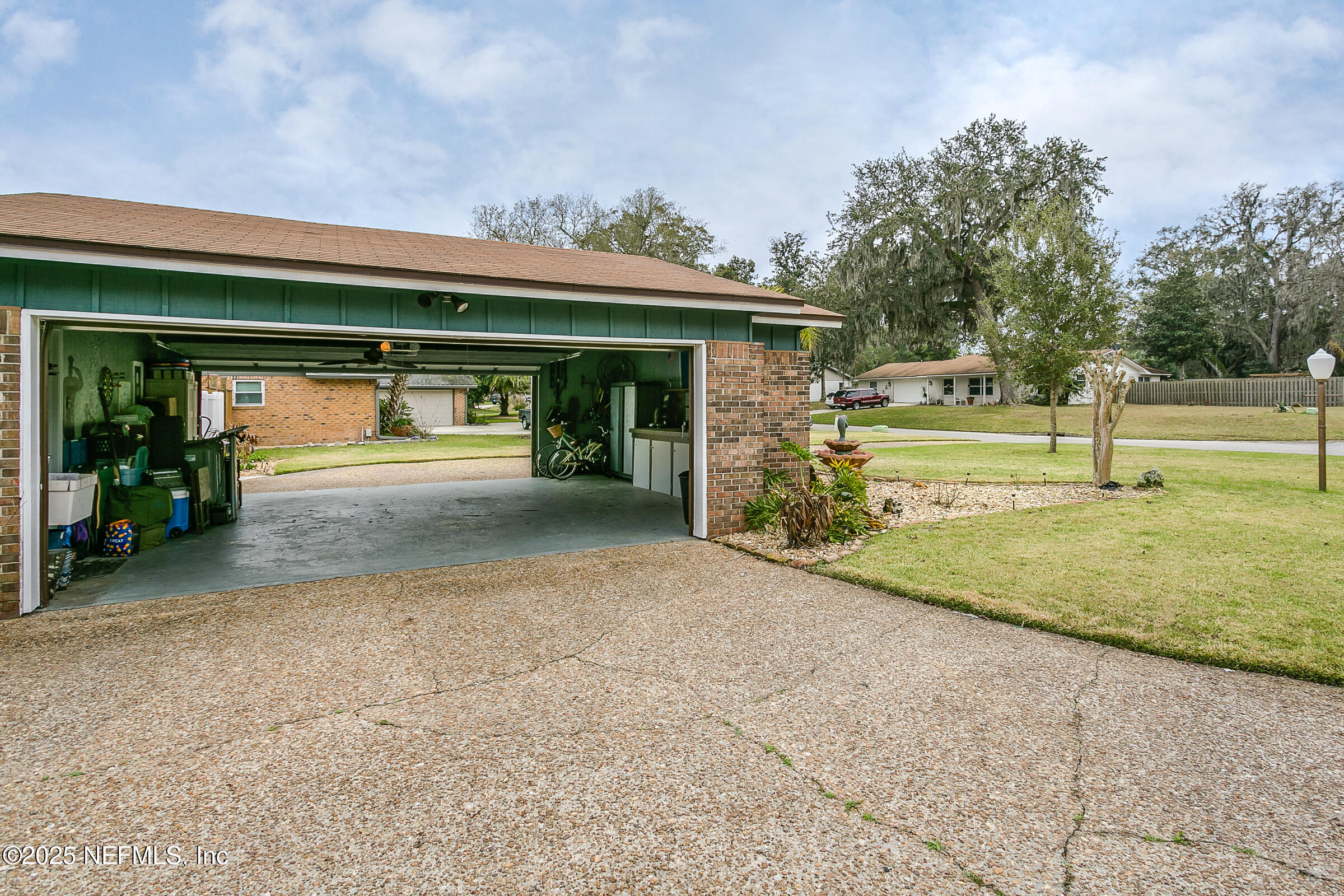 6433 River Point Drive Fleming Island, FL 32003 - Photo 66 of 76 a view of a house with backyard and trees
