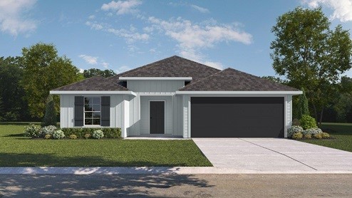 530 Hunters Grove Lane Beaumont, TX 77713 - Photo 3 of 24 a front view of a house with a yard and garage
