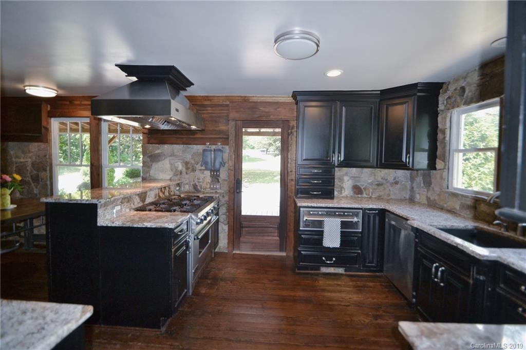 3431 Lee Moore Road Maiden, NC 28650 - Photo 12 of 44 a kitchen with a sink stove top oven and refrigerator