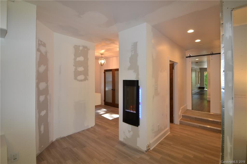 3431 Lee Moore Road Maiden, NC 28650 - Photo 17 of 44 a view of a hallway with wooden floor and staircase