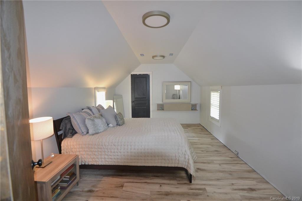 3431 Lee Moore Road Maiden, NC 28650 - Photo 24 of 44 a bedroom with a bed and a mirror