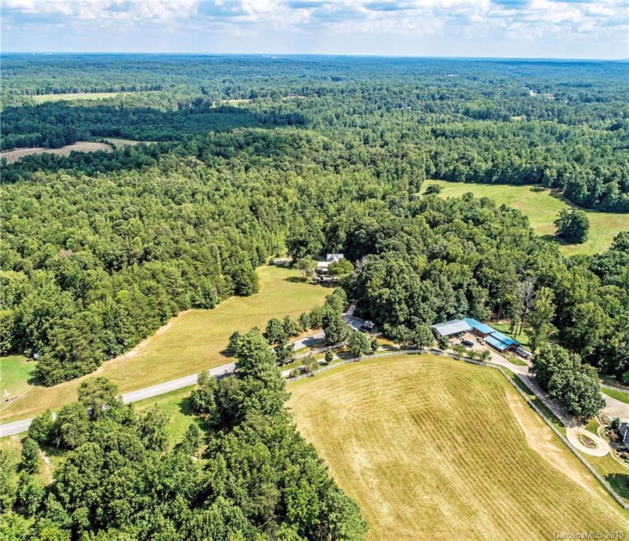 3431 Lee Moore Road Maiden, NC 28650 - Photo 35 of 44 a view of a lake with big yard and large trees