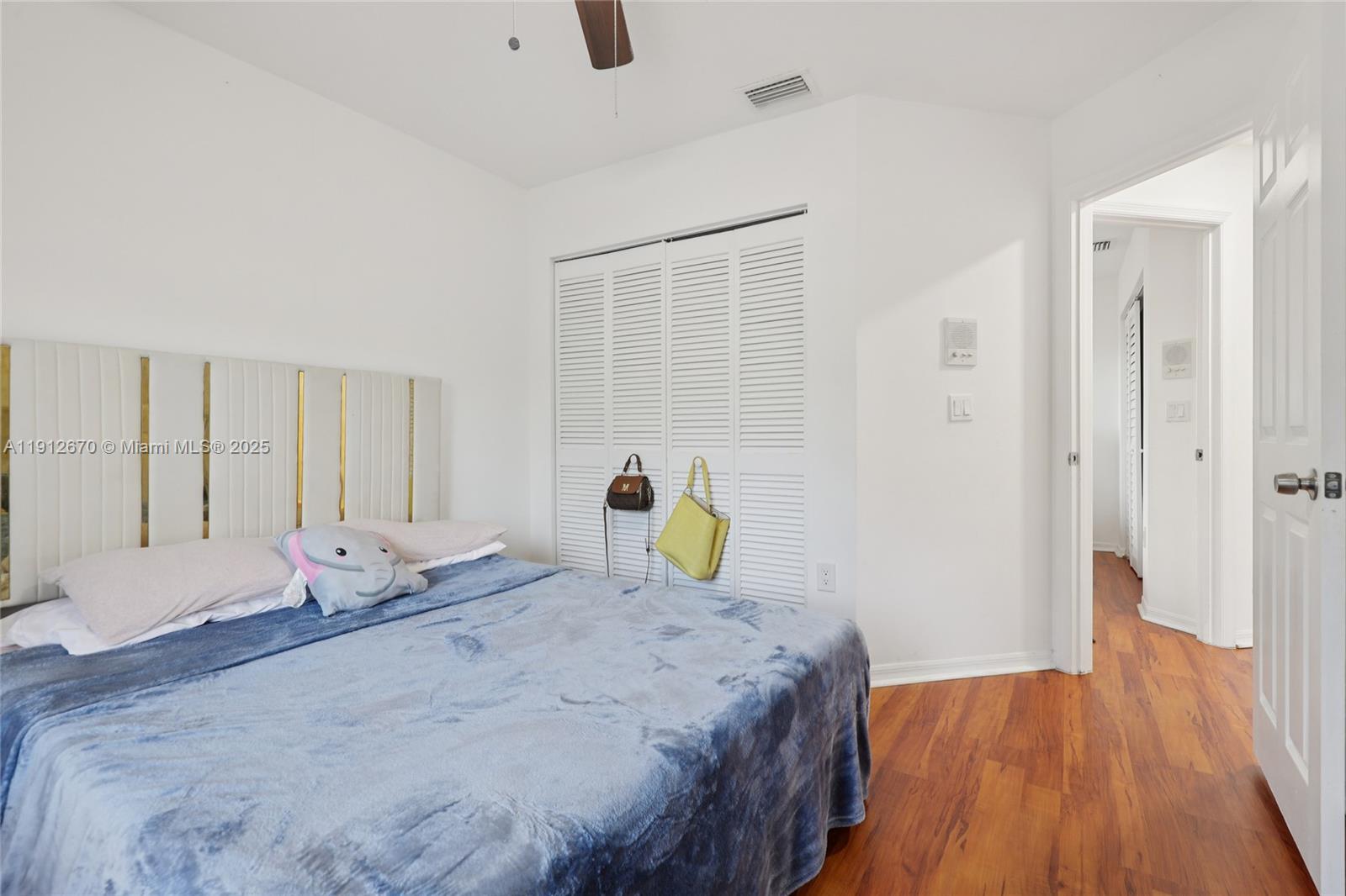 14804 Southwest 155th Place Miami, FL 33196 - Photo 19 of 35 a bedroom with bed and wooden floor