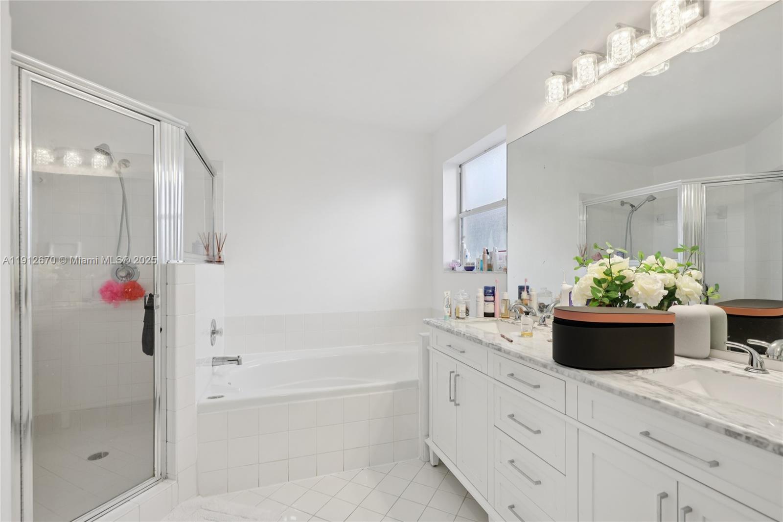 14804 Southwest 155th Place Miami, FL 33196 - Photo 27 of 35 a bathroom with a bathtub shower and a mirror