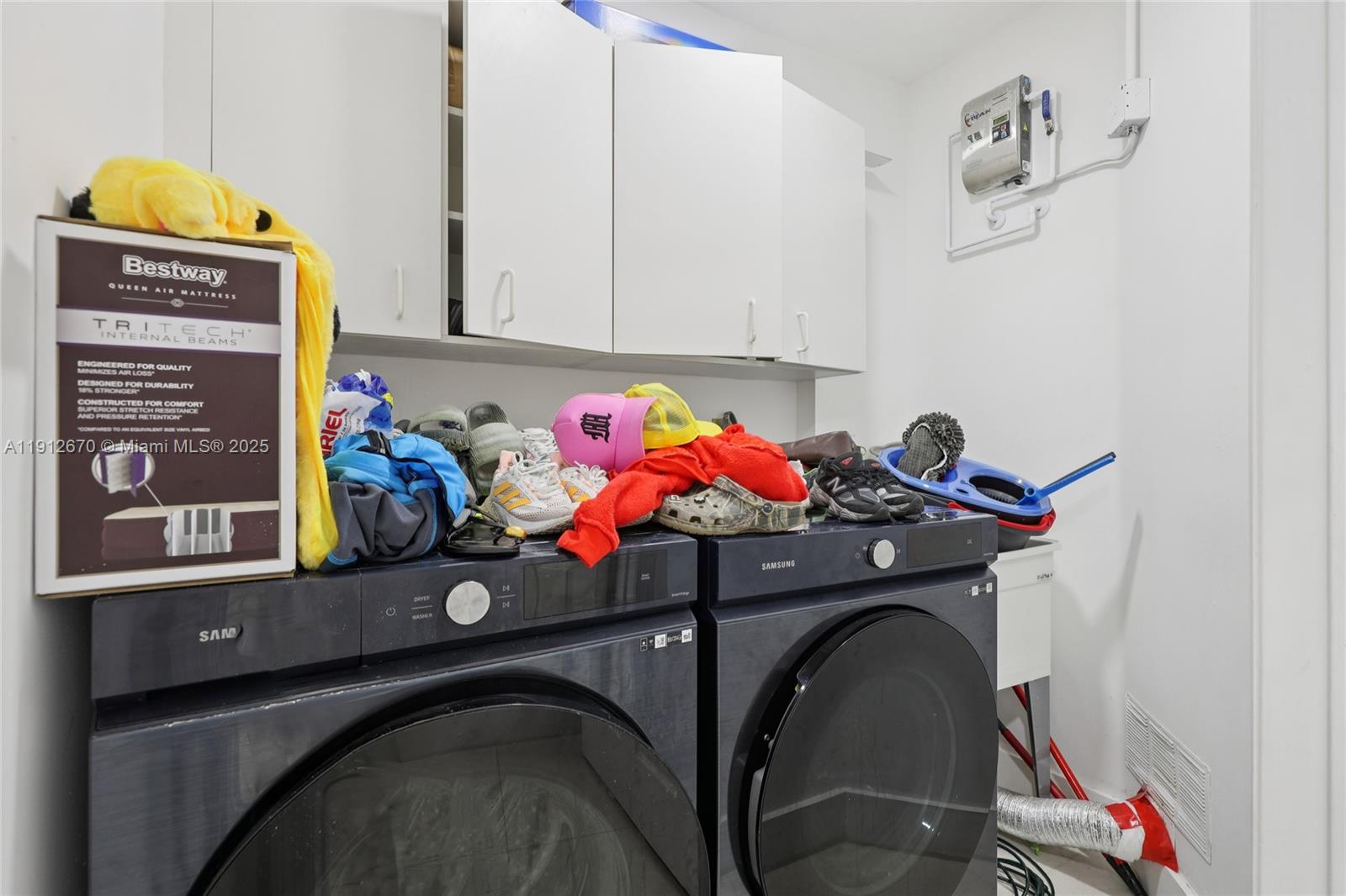 14804 Southwest 155th Place Miami, FL 33196 - Photo 32 of 35 a utility room with dryer and washer