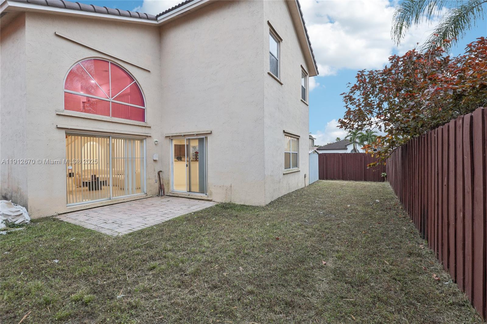 14804 Southwest 155th Place Miami, FL 33196 - Photo 33 of 35 a house view with a backyard space