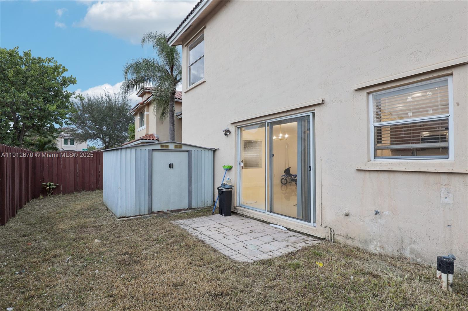 14804 Southwest 155th Place Miami, FL 33196 - Photo 34 of 35 a view of a house with a backyard