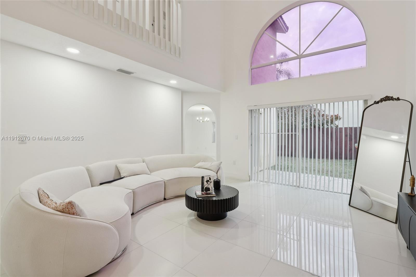 14804 Southwest 155th Place Miami, FL 33196 - Photo 5 of 35 a living room with furniture a couch and a table