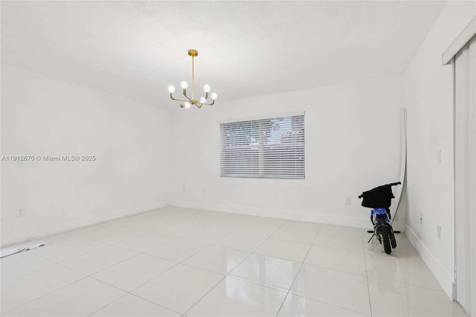 14804 Southwest 155th Place Miami, FL 33196 - Photo 7 of 35 wooden floor in an empty room with a window