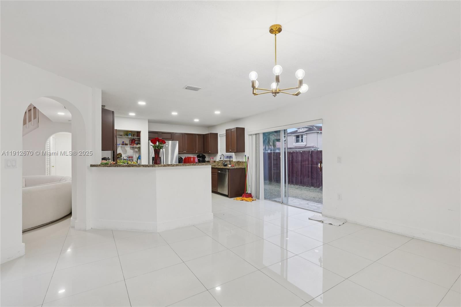 14804 Southwest 155th Place Miami, FL 33196 - Photo 8 of 35 a view of a kitchen with a refrigerator and a sink