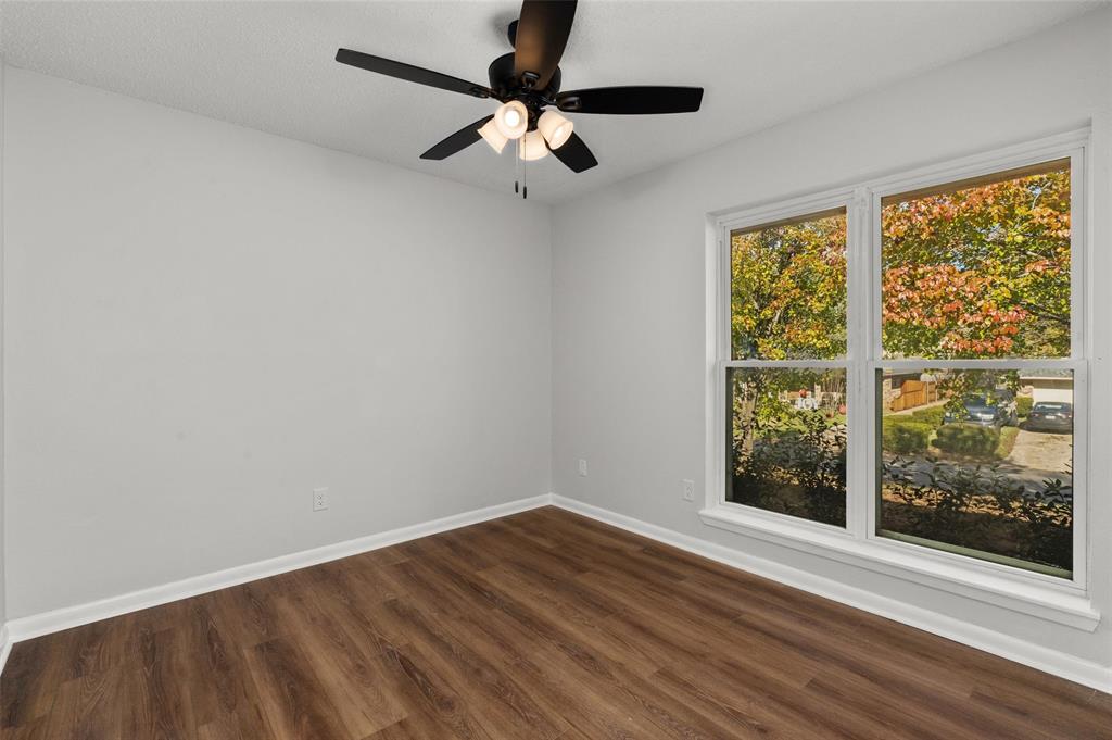 809 Princesa Drive Haughton, LA 71037 - Photo 11 of 17 a view of an empty room with wooden floor and a window