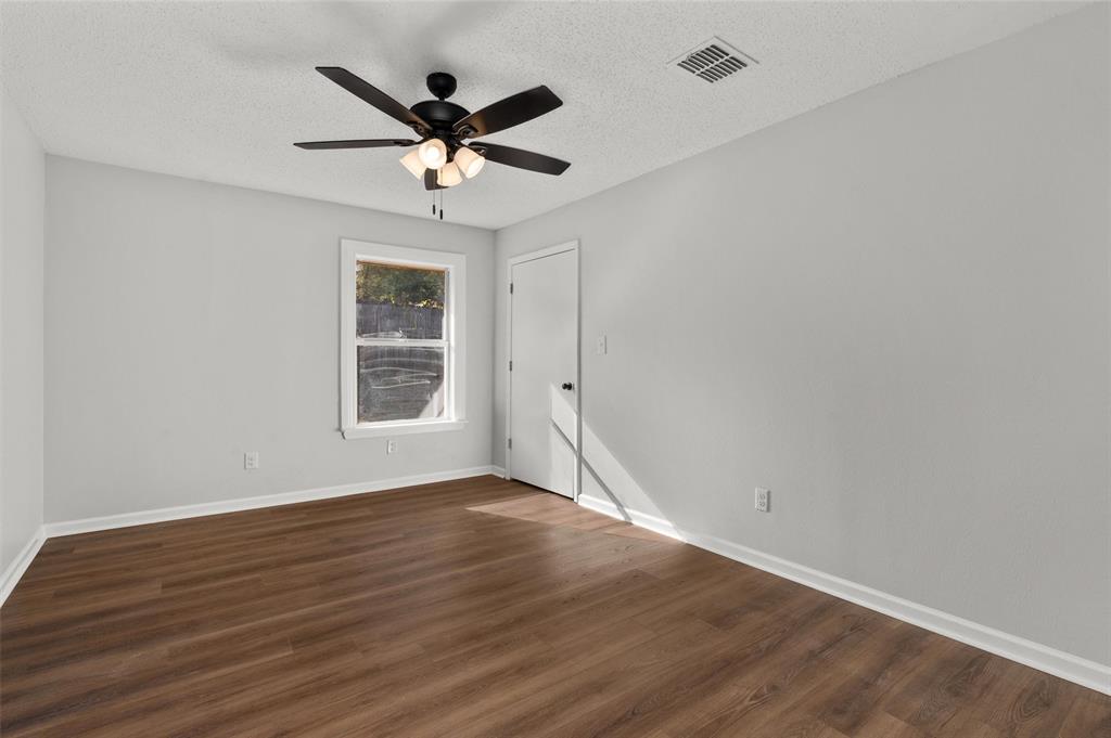 809 Princesa Drive Haughton, LA 71037 - Photo 11 of 17 wooden floor in an empty room with a window