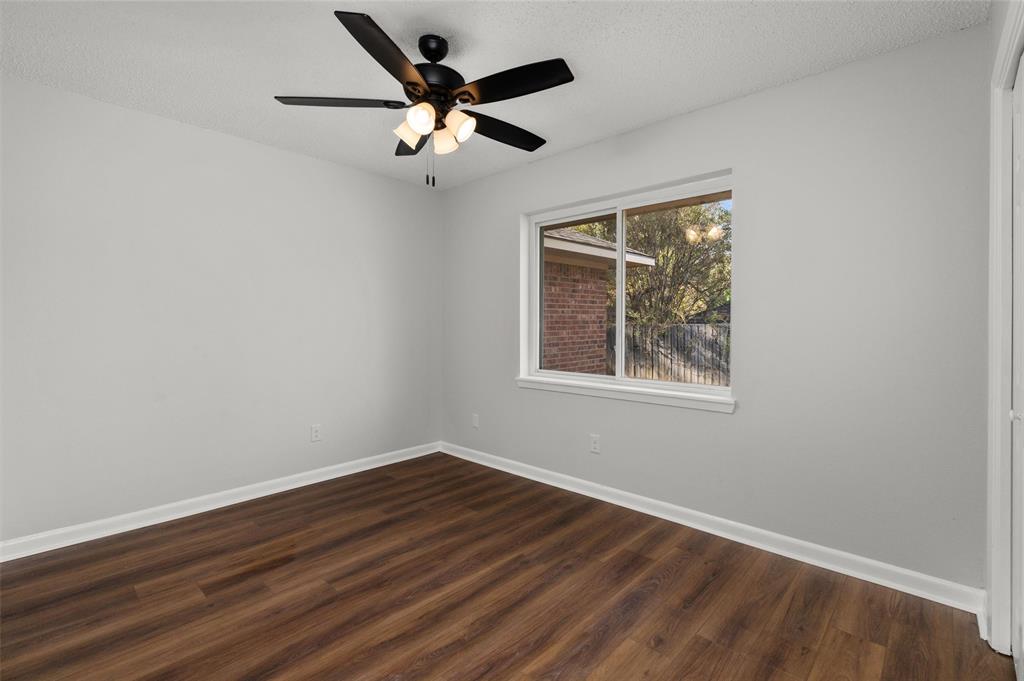 809 Princesa Drive Haughton, LA 71037 - Photo 13 of 17 a view of an empty room with wooden floor and a window